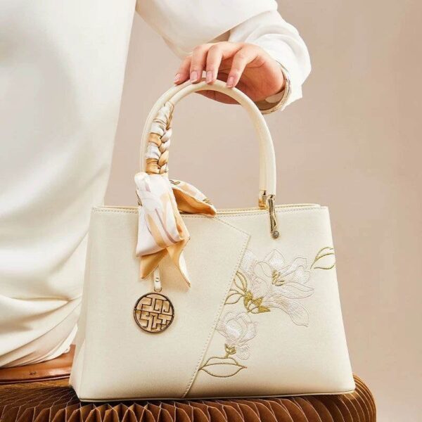 Embroidery_Leather_Magnolia_Leather_Tote_Bag_-_SinoCultural-2474068.jpg Embroidery_Leather_Magnolia_Leather_Tote_Bag_-_SinoCultural-2474068.jpg