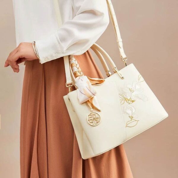 Embroidery_Leather_Magnolia_Leather_Tote_Bag_-_SinoCultural-2474079.jpg Embroidery_Leather_Magnolia_Leather_Tote_Bag_-_SinoCultural-2474079.jpg