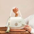 Embroidery_Leather_Vintage_White_Lotus_Handbag_with_Pendant_-_SinoCultural-2476532.jpg