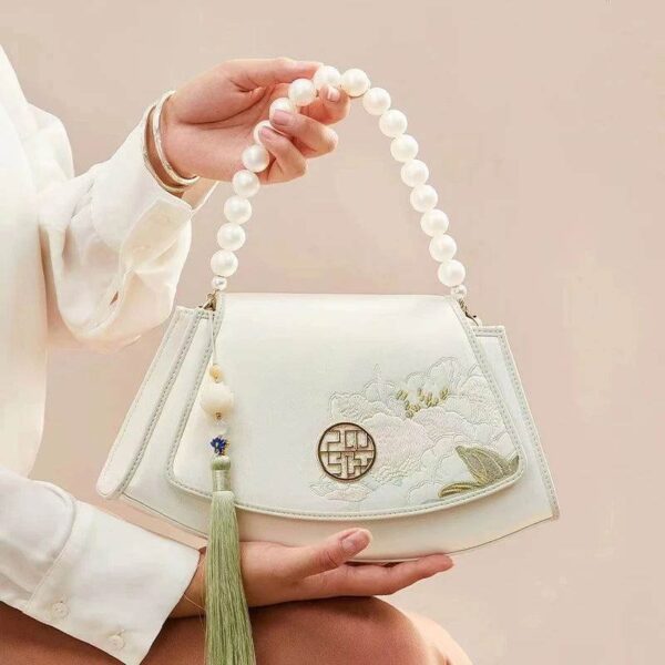 Embroidery_Leather_Vintage_White_Lotus_Handbag_with_Pendant_-_SinoCultural-2476538.jpg Embroidery_Leather_Vintage_White_Lotus_Handbag_with_Pendant_-_SinoCultural-2476538.jpg