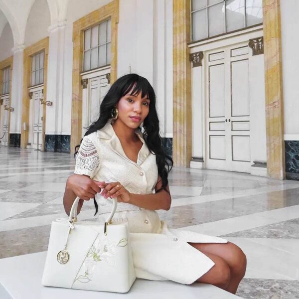 embroidery-leather-magnolia-tote-bag-scarf-model-back.jpg embroidery-leather-magnolia-tote-bag-scarf-model-back.jpg