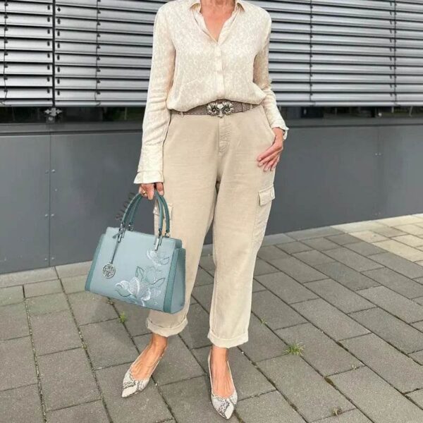 magnolia-tote-handheld-detail-lifestyle-red-model.jpg magnolia-tote-handheld-detail-lifestyle-red-model.jpg