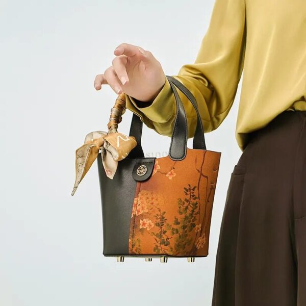 model-arm-carry-plum-blossom-handbag-front.jpg model-arm-carry-plum-blossom-handbag-front.jpg