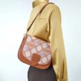 model-carrying-brocade-messenger-bag-shoulder.jpg