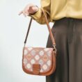 model-holding-brocade-bag-single-hand.jpg