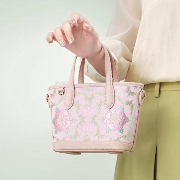 model-holding-brocade-crossbody-bag-single-hand.jpg model-holding-brocade-crossbody-bag-single-hand.jpg