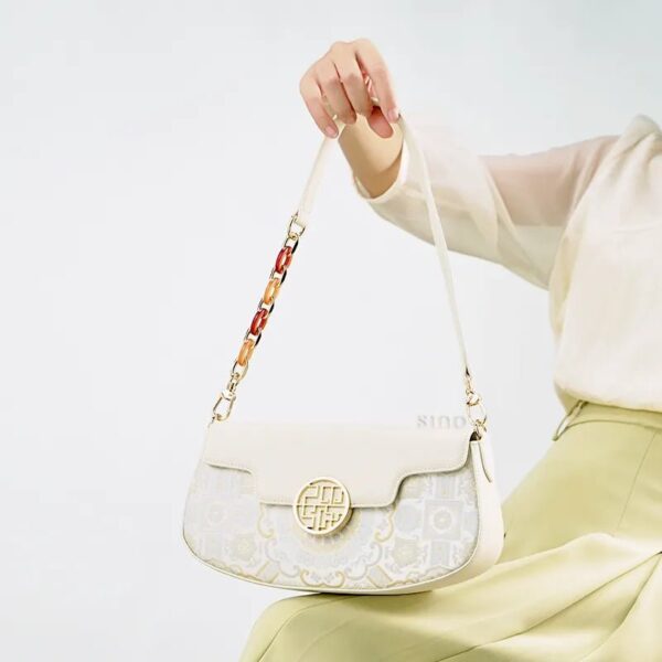 model-holding-octagonal-brocade-bag-seated.jpg model-holding-octagonal-brocade-bag-seated.jpg