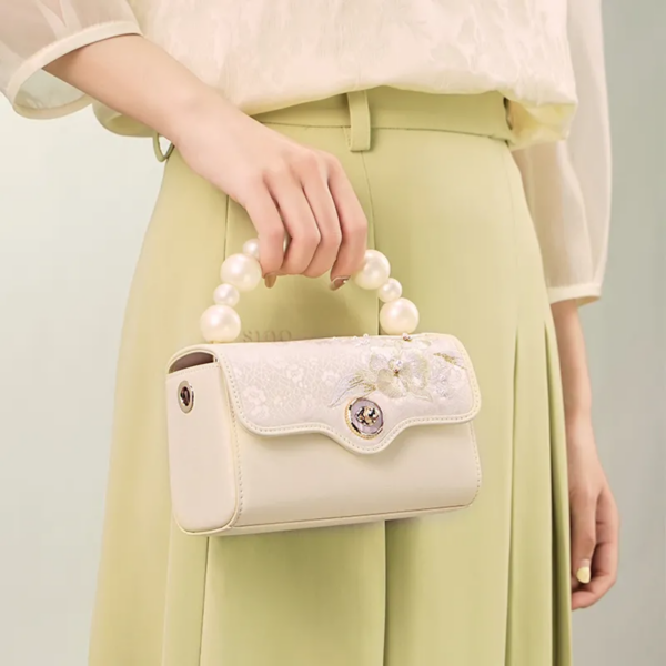 model-holding-orchid-butterfly-bag-front.png model-holding-orchid-butterfly-bag-front.png