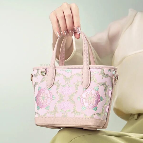 model-seated-carrying-brocade-bag-on-knees.jpg model-seated-carrying-brocade-bag-on-knees.jpg