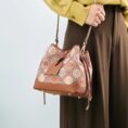 model-wearing-brocade-bucket-bag-shoulder.jpg