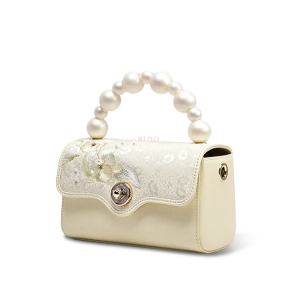 orchid-butterfly-embroidered-silk-handbag-side.png orchid-butterfly-embroidered-silk-handbag-side.png