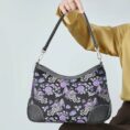shu-brocade-shoulder-bag-classic-phoenix-peony-motif-model-sitting-knee-handheld.jpg