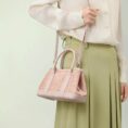 song-brocade-pink-dingsheng-crossbody-bag-model-green-dress-shoulder.jpg