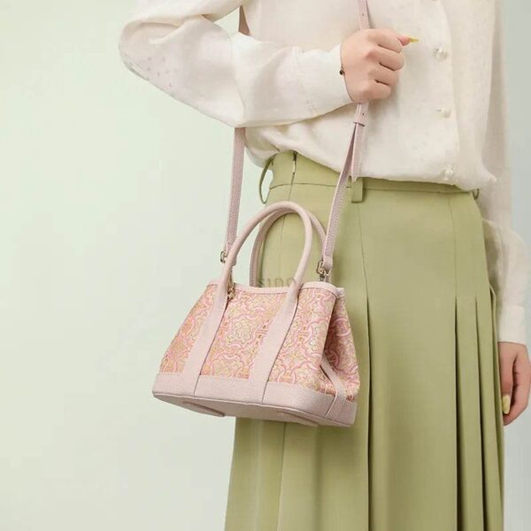 song-brocade-pink-dingsheng-crossbody-bag-model-green-dress-shoulder.jpg song-brocade-pink-dingsheng-crossbody-bag-model-green-dress-shoulder.jpg