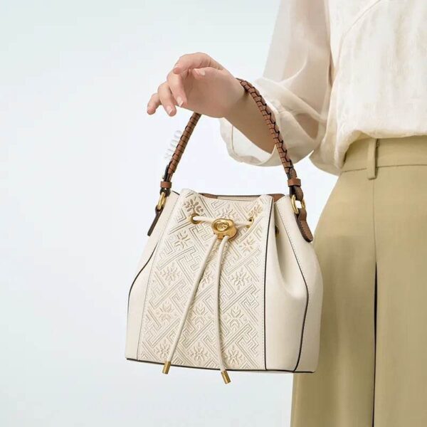 wanj-pattern-embroidered-leather-convertible-backpack-tote-model-handheld.jpg wanj-pattern-embroidered-leather-convertible-backpack-tote-model-handheld.jpg