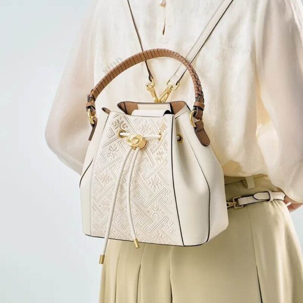 wanj-pattern-embroidered-leather-convertible-backpack-tote-model-wearing-backpack-from-behind.jpg wanj-pattern-embroidered-leather-convertible-backpack-tote-model-wearing-backpack-from-behind.jpg