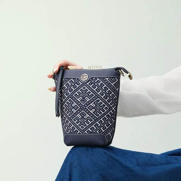 zhuang-brocade-bucket-crossbody-bag-model-blue-dress-sitting-knee.jpg zhuang-brocade-bucket-crossbody-bag-model-blue-dress-sitting-knee.jpg