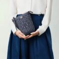 zhuang-brocade-bucket-crossbody-bag-model-blue-dress-waist-hold.jpg