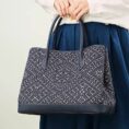 zhuang-brocade-embroidered-leather-shoulder-bag-model-double-handheld-blue-dress.jpg
