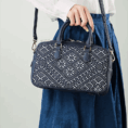 zhuang-brocade-flying-swallow-embroidered-leather-crossbody-bag-model-blue-dress-crossbody.png