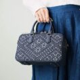 zhuang-brocade-flying-swallow-embroidered-leather-crossbody-bag-model-blue-dress-top-handle.jpg