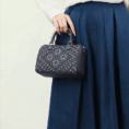 zhuang-brocade-flying-swallow-tote-bag-model-handheld-blue-dress.png