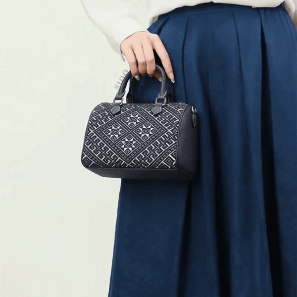zhuang-brocade-flying-swallow-tote-bag-model-handheld-blue-dress.png zhuang-brocade-flying-swallow-tote-bag-model-handheld-blue-dress.png
